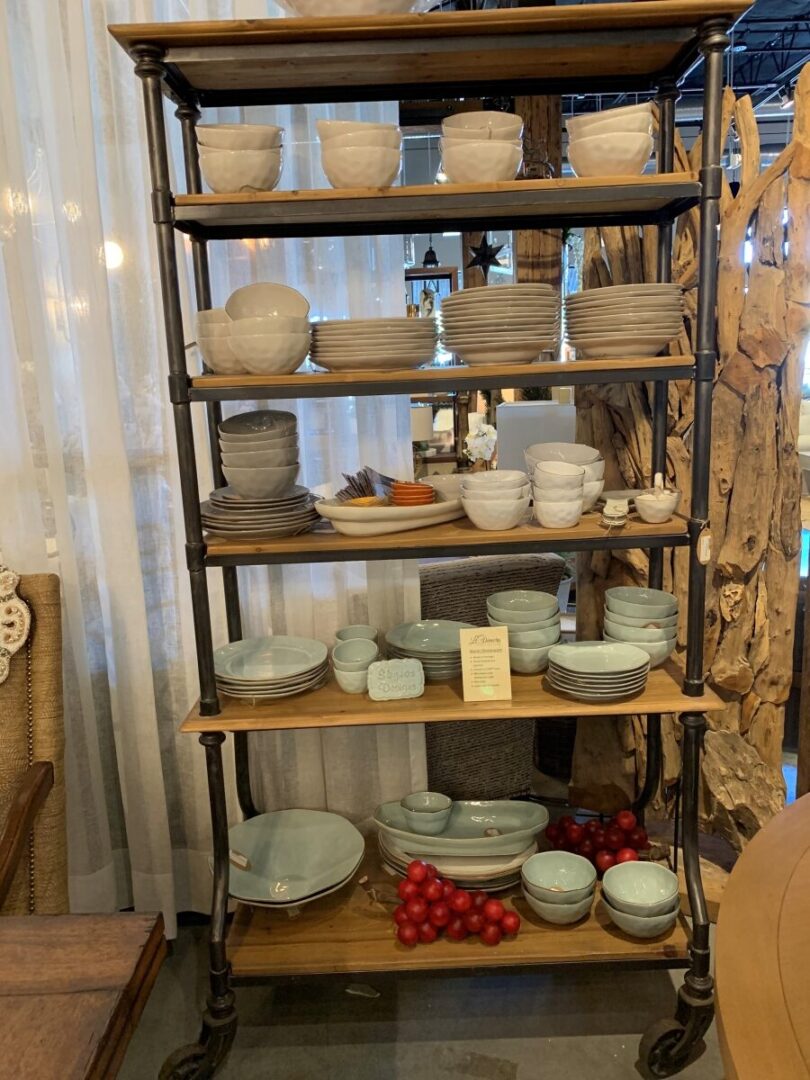 A shelf with many different types of bowls.
