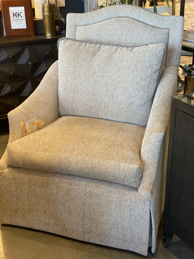 A chair with a cushion on it's back.