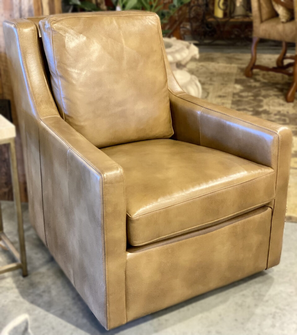 A leather chair with a brown seat and back.
