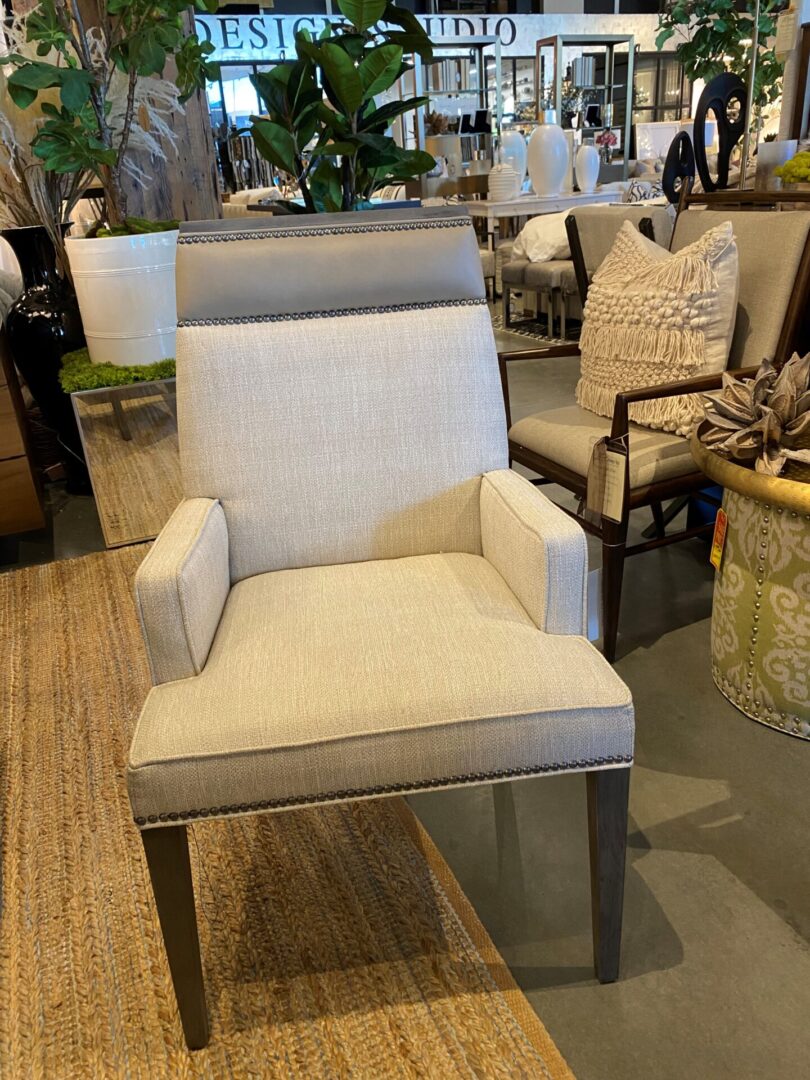 A chair with a white and grey fabric on it